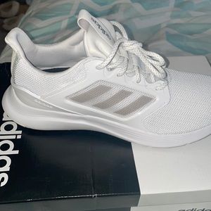 White Adidas tennis shoe.